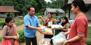 Chinese aid workers distributing supplies in Myanmar village.